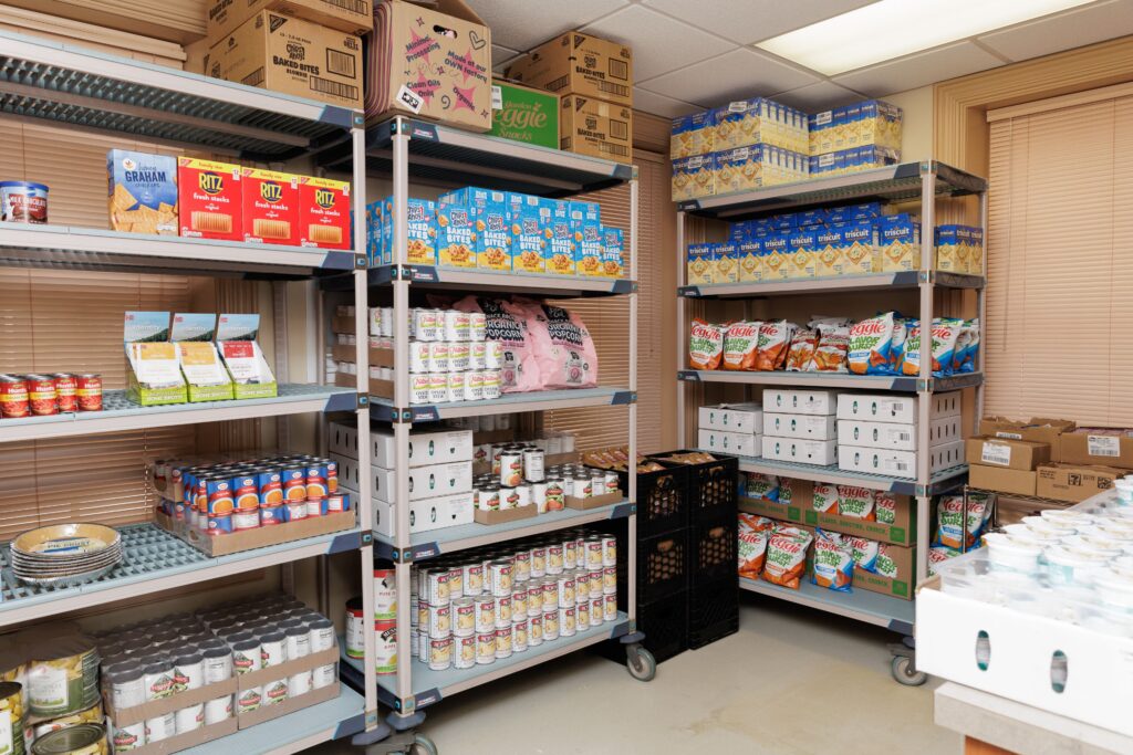 Variety of canned items, pasta, chips, and more on shelves